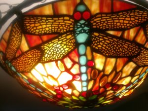 Dragonflies appear in many different forms of art, including stained glass lamp shades. Photo courtesy of Chris Pupke.